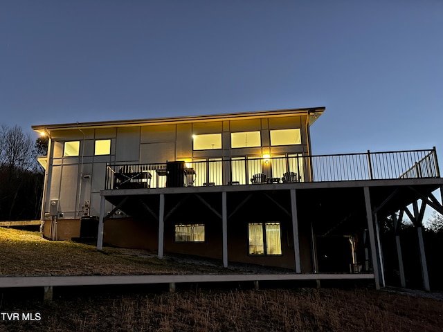 back of property featuring a deck
