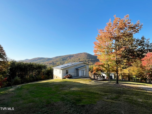 exterior space featuring a mountain view
