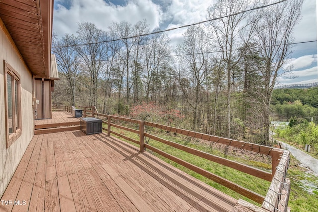 deck featuring a wooded view