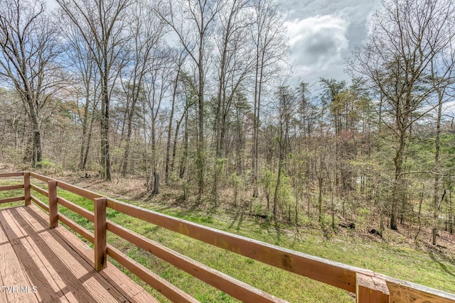 deck with a wooded view