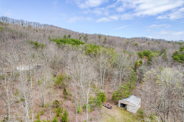 aerial view featuring a forest view