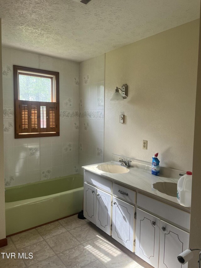 4235 Kiser Rd, Coeburn, VA 24230 - bathroom with double vanity, a textured ceiling, and a bath