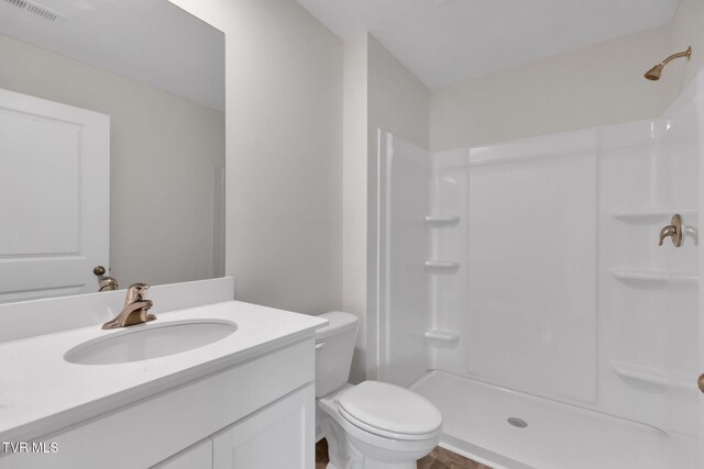 1122 Aspen Ter, Greeneville, TN 37745 - bathroom featuring visible vents, toilet, vanity, and walk in shower