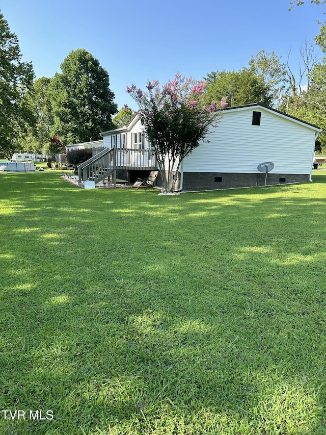 view of yard featuring a deck