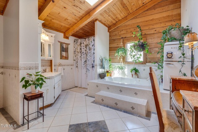 full bathroom featuring vanity, vaulted ceiling with beams, a garden tub, tile patterned flooring, and wooden ceiling