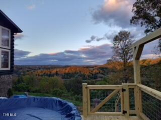 view of pool at dusk