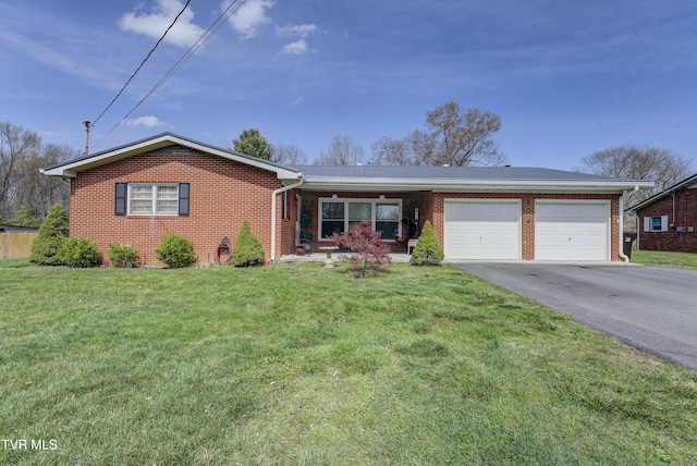 216 Nelson Ave, Piney Flats, TN 37686 - ranch-style home with brick siding, driveway, a garage, and a front lawn