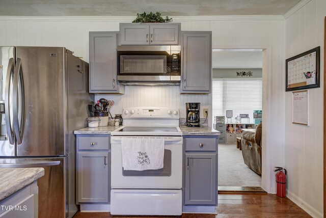 216 Nelson Ave, Piney Flats, TN 37686 - kitchen with crown molding, gray cabinets, light countertops, and appliances with stainless steel finishes