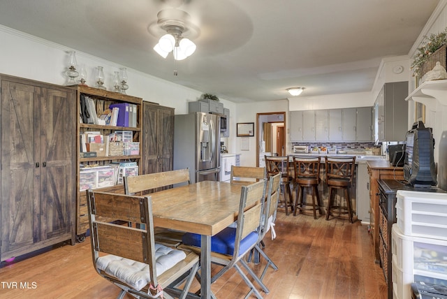 216 Nelson Ave, Piney Flats, TN 37686 - dining space featuring light wood-type flooring, crown molding, and ceiling fan