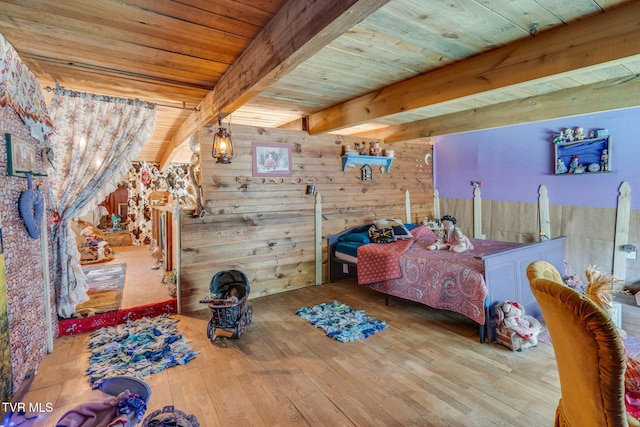 bedroom featuring wooden walls, wooden ceiling, beam ceiling, and hardwood / wood-style floors
