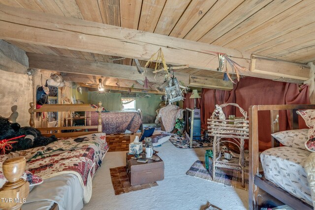 bedroom featuring carpet flooring and wooden ceiling
