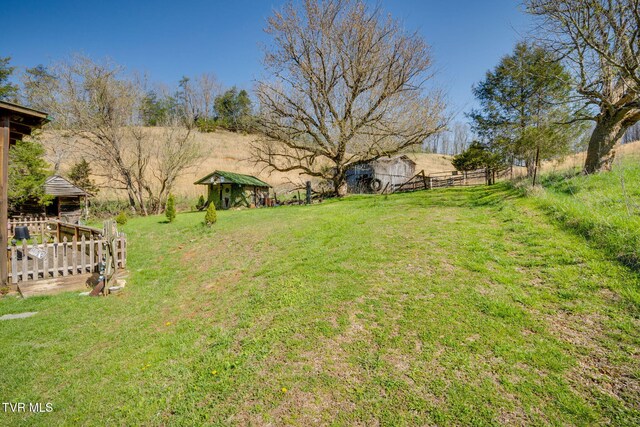 view of yard featuring fence and a gazebo