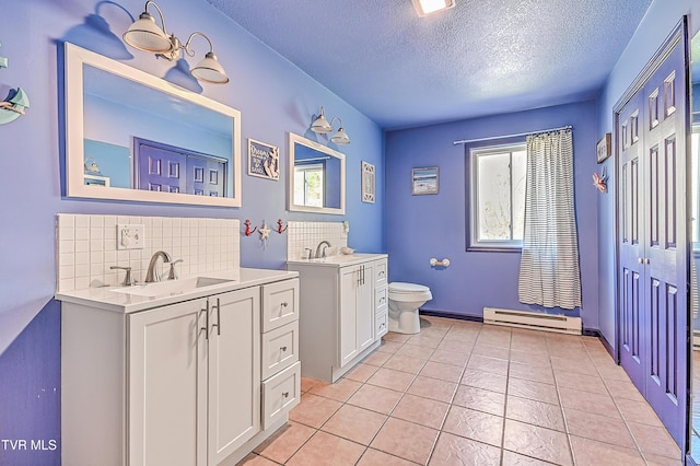 full bath featuring backsplash, a baseboard heating unit, and a sink