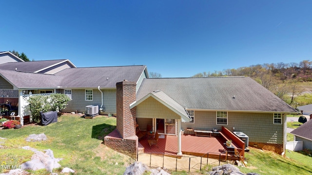 93 Bridgewater Ct Unit 93, Johnson City, TN 37615 - rear view of house featuring central AC, a deck, a lawn, a chimney, and roof with shingles