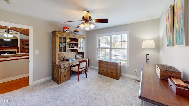 93 Bridgewater Ct Unit 93, Johnson City, TN 37615 - home office featuring light carpet, ceiling fan, baseboards, and a fireplace