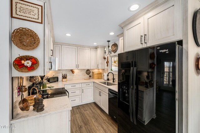 403 Deerlick Rd, Piney Flats, TN 37686 - kitchen with a sink, dark wood-style floors, black appliances, decorative backsplash, and recessed lighting