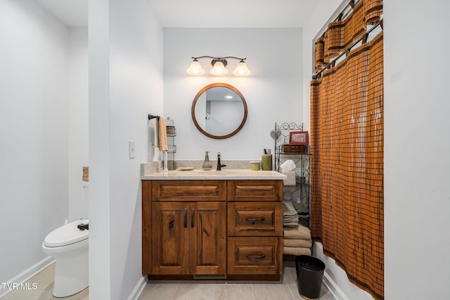 403 Deerlick Rd, Piney Flats, TN 37686 - bathroom featuring tile patterned floors, toilet, baseboards, and vanity