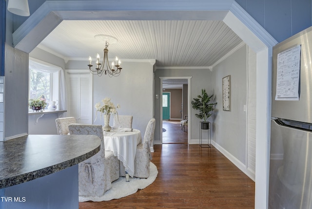 5744 Orebank Rd, Kingsport, TN 37664 - dining room featuring dark wood-style flooring, baseboards, a chandelier, and crown molding