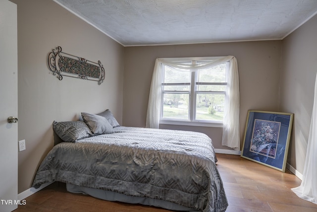 5744 Orebank Rd, Kingsport, TN 37664 - bedroom with crown molding, baseboards, and wood finished floors