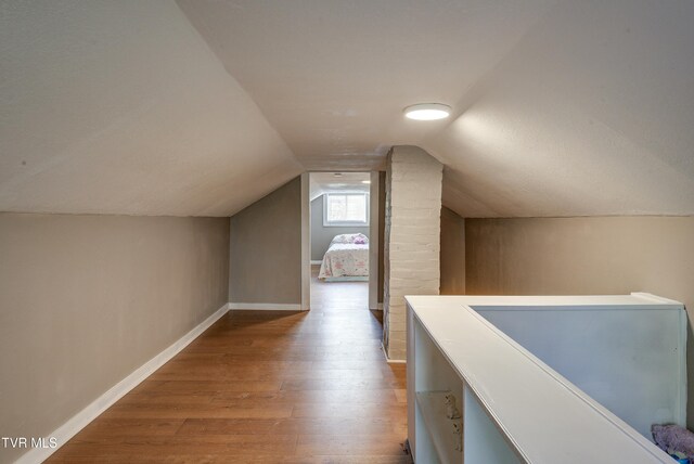 5744 Orebank Rd, Kingsport, TN 37664 - additional living space with lofted ceiling, baseboards, and wood finished floors