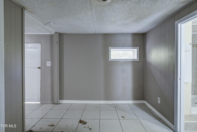 5744 Orebank Rd, Kingsport, TN 37664 - empty room with light tile patterned floors, a textured ceiling, and baseboards