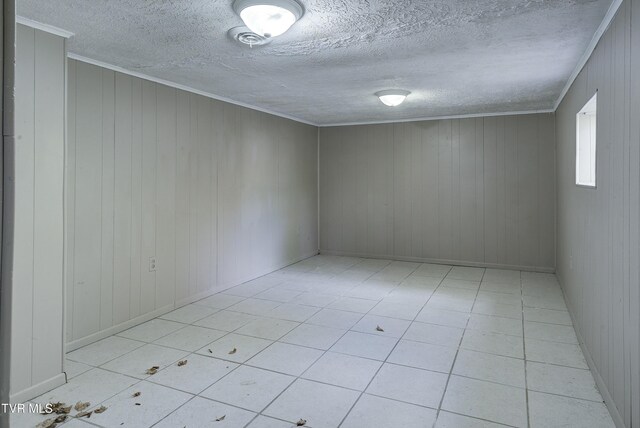 5744 Orebank Rd, Kingsport, TN 37664 - unfurnished room with ornamental molding, light tile patterned floors, and a textured ceiling