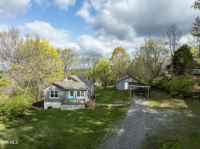5744 Orebank Rd, Kingsport, TN 37664 - view of front facade featuring a detached carport, a wooden deck, driveway, and a front lawn