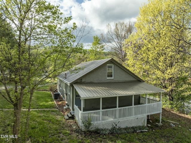 5744 Orebank Rd, Kingsport, TN 37664 - exterior space featuring metal roof, central AC, a sunroom, and a lawn