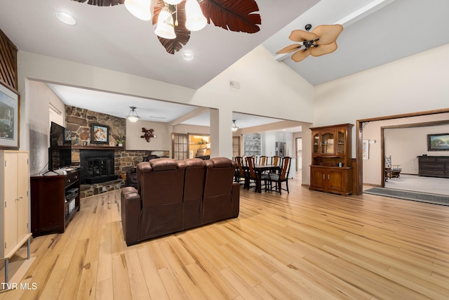 166 Lonesome Dove Ln, Elizabethton, TN 37643 - living room with high vaulted ceiling, a fireplace, light wood-style floors, and a ceiling fan