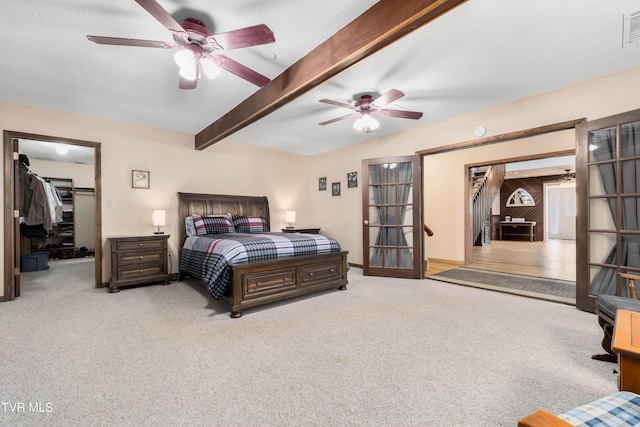 166 Lonesome Dove Ln, Elizabethton, TN 37643 - bedroom featuring a spacious closet, visible vents, beam ceiling, ceiling fan, and carpet