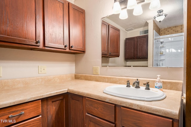 166 Lonesome Dove Ln, Elizabethton, TN 37643 - full bathroom featuring visible vents, a textured ceiling, crown molding, a shower stall, and vanity