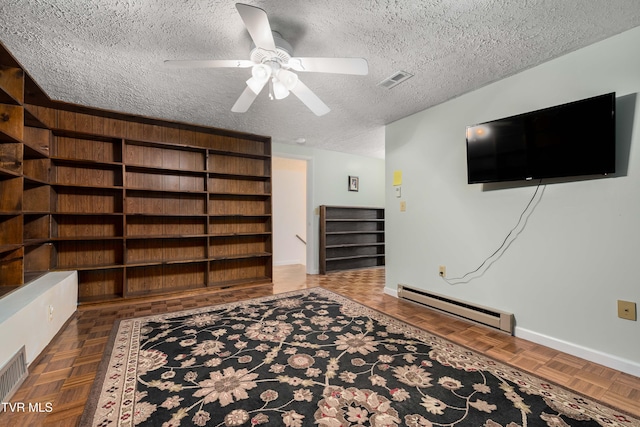 166 Lonesome Dove Ln, Elizabethton, TN 37643 - interior space with visible vents, baseboards, ceiling fan, a textured ceiling, and baseboard heating