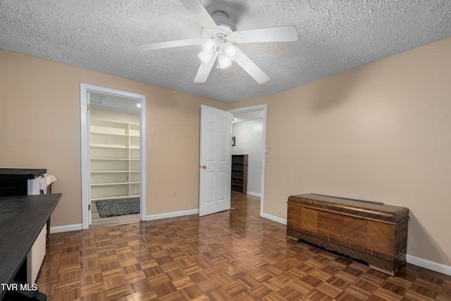 166 Lonesome Dove Ln, Elizabethton, TN 37643 - interior space with a textured ceiling, ceiling fan, baseboards, and a spacious closet