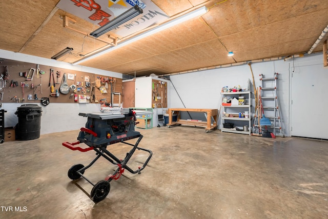 166 Lonesome Dove Ln, Elizabethton, TN 37643 - garage featuring concrete block wall and a workshop area