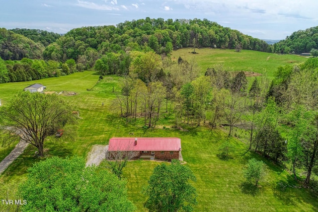aerial view featuring a rural view and a forest view