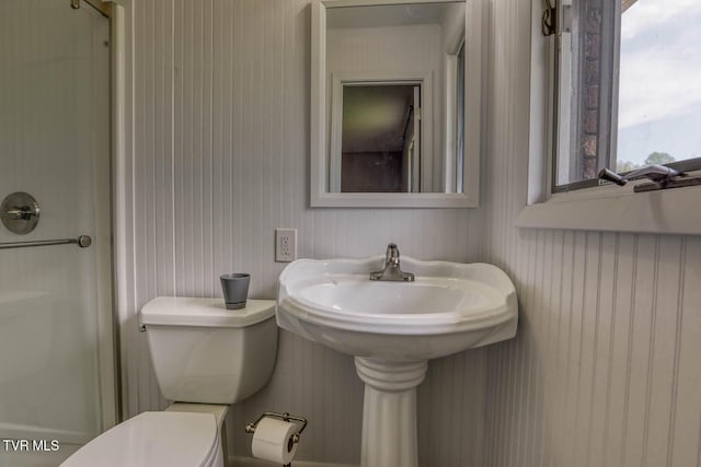 full bath featuring wooden walls, toilet, and a shower