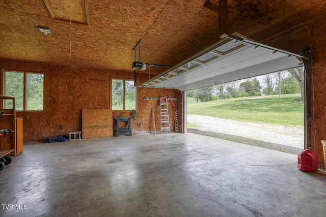 garage with a wood stove and a garage door opener
