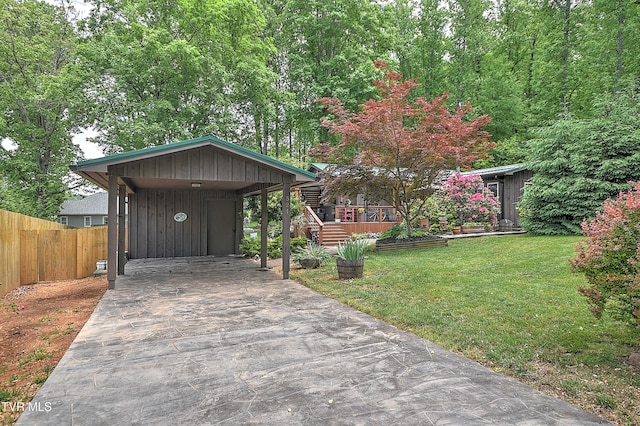 521 Baywood Dr, Piney Flats, TN 37686 - view of front of home featuring driveway, board and batten siding, and a carport