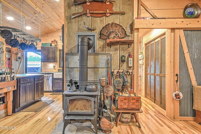 521 Baywood Dr, Piney Flats, TN 37686 - kitchen featuring a wood stove, light wood finished floors, wooden ceiling, dishwasher, and high vaulted ceiling