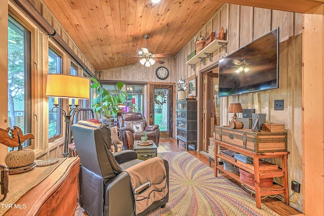 521 Baywood Dr, Piney Flats, TN 37686 - living area with wood finished floors, wooden walls, lofted ceiling, ceiling fan, and wooden ceiling