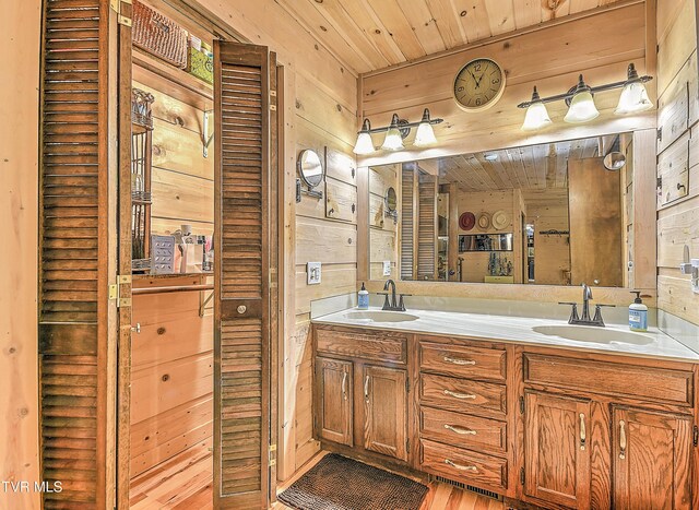 521 Baywood Dr, Piney Flats, TN 37686 - full bath featuring wooden walls, wooden ceiling, double vanity, and wood finished floors
