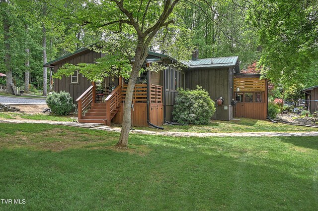 521 Baywood Dr, Piney Flats, TN 37686 - view of front of house featuring a front yard, stairs, a chimney, and board and batten siding