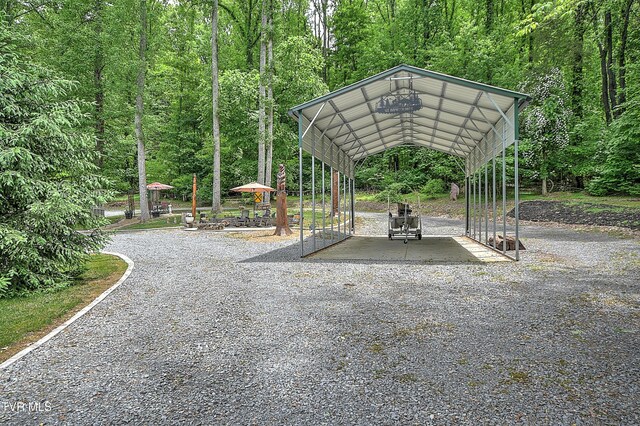 521 Baywood Dr, Piney Flats, TN 37686 - view of community with a detached carport and a wooded view