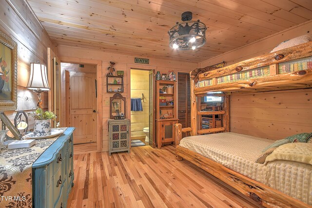 521 Baywood Dr, Piney Flats, TN 37686 - bedroom with wood walls, light wood-style flooring, and wood ceiling
