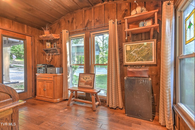 521 Baywood Dr, Piney Flats, TN 37686 - living area featuring lofted ceiling, wood walls, wood ceiling, hardwood / wood-style floors, and healthy amount of natural light