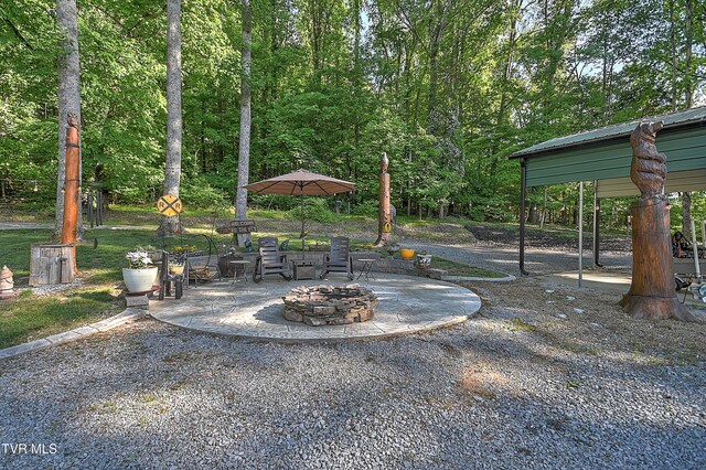 521 Baywood Dr, Piney Flats, TN 37686 - view of yard with a fire pit and a patio