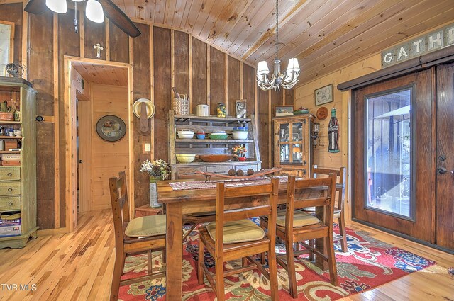 521 Baywood Dr, Piney Flats, TN 37686 - dining area with lofted ceiling, wooden walls, wood ceiling, wood finished floors, and a chandelier