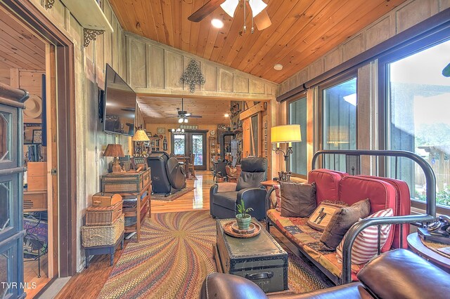 521 Baywood Dr, Piney Flats, TN 37686 - living room featuring ceiling fan, wood finished floors, wooden walls, wood ceiling, and lofted ceiling