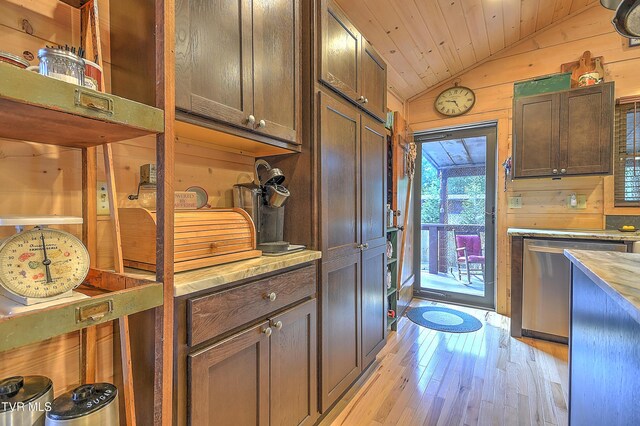 521 Baywood Dr, Piney Flats, TN 37686 - kitchen with lofted ceiling, dishwasher, light wood-type flooring, wooden walls, and light countertops