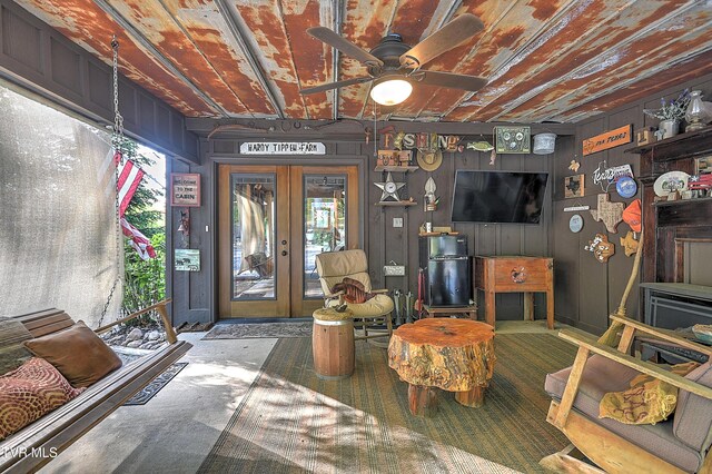 521 Baywood Dr, Piney Flats, TN 37686 - living room featuring plenty of natural light, a ceiling fan, french doors, and wooden walls